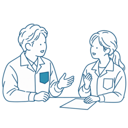 机ごしに打ち合わせをする2人のイラスト